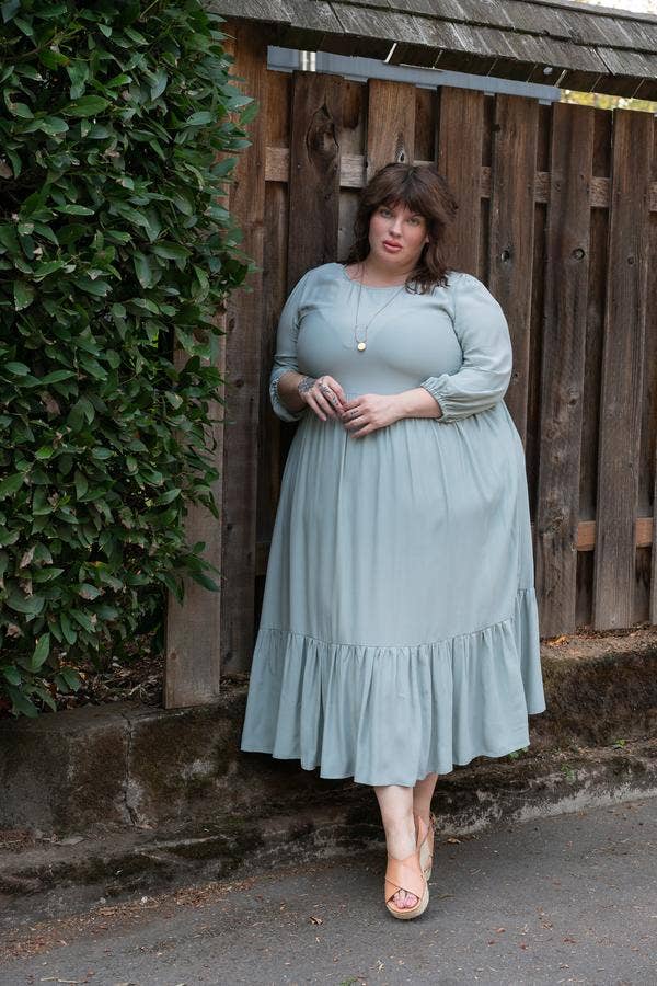 Beautiful plus size woman wearing blue green midi dress | Plus Size Sustainable Fashion