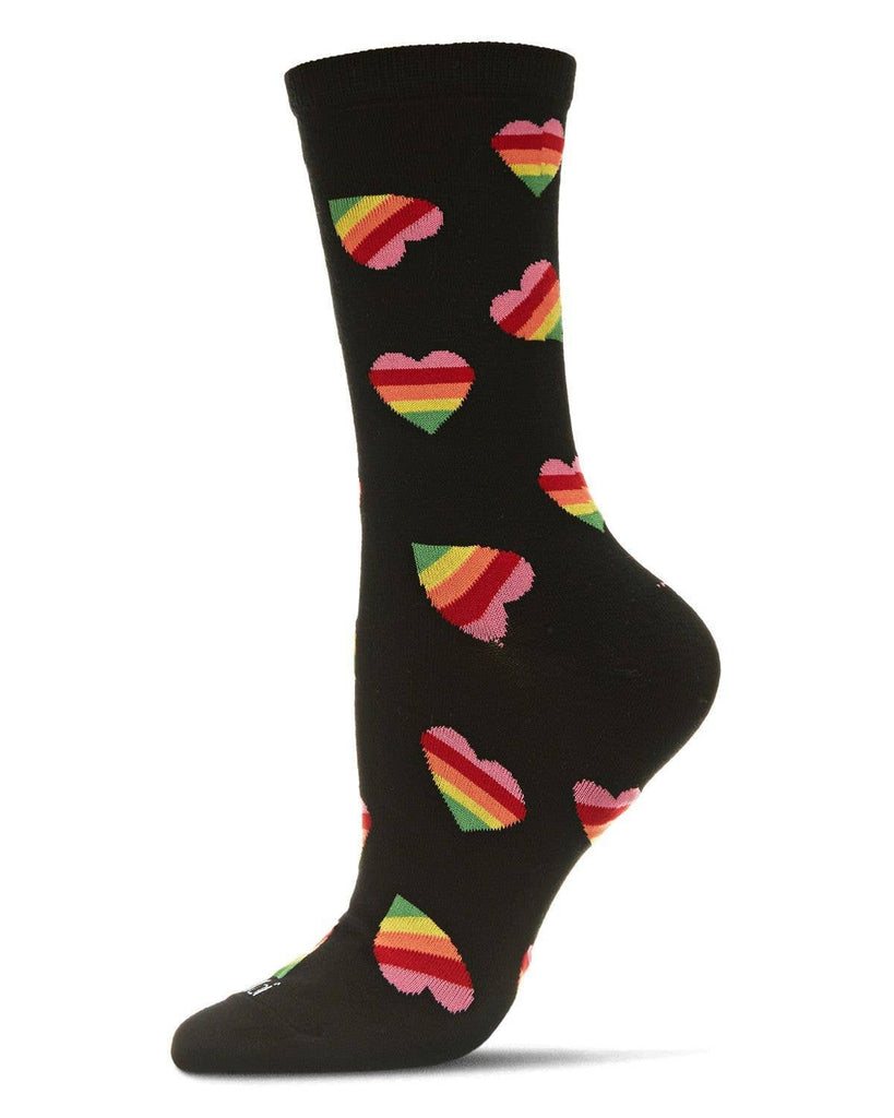 A black Rainbow Pride Heart Bamboo Crew sock, adorned with colorful heart patterns featuring rainbow stripes. The pride sock is displayed on a mannequin foot, angled to show the design clearly.